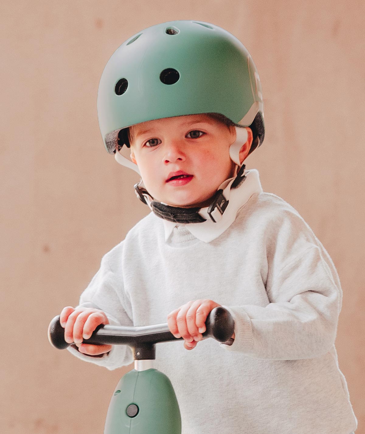 Child wearing the Scoot and Ride Helmet Forest