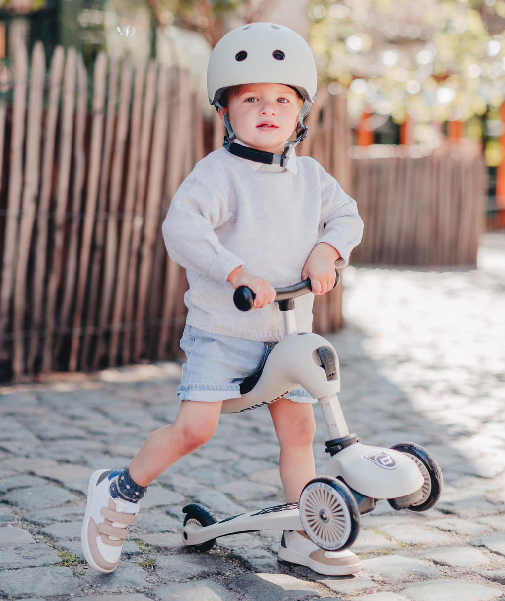 A toddler confidently riding the Scoot and Ride Highway Kick 1